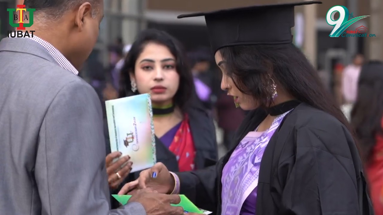 A graduate with family at convocation